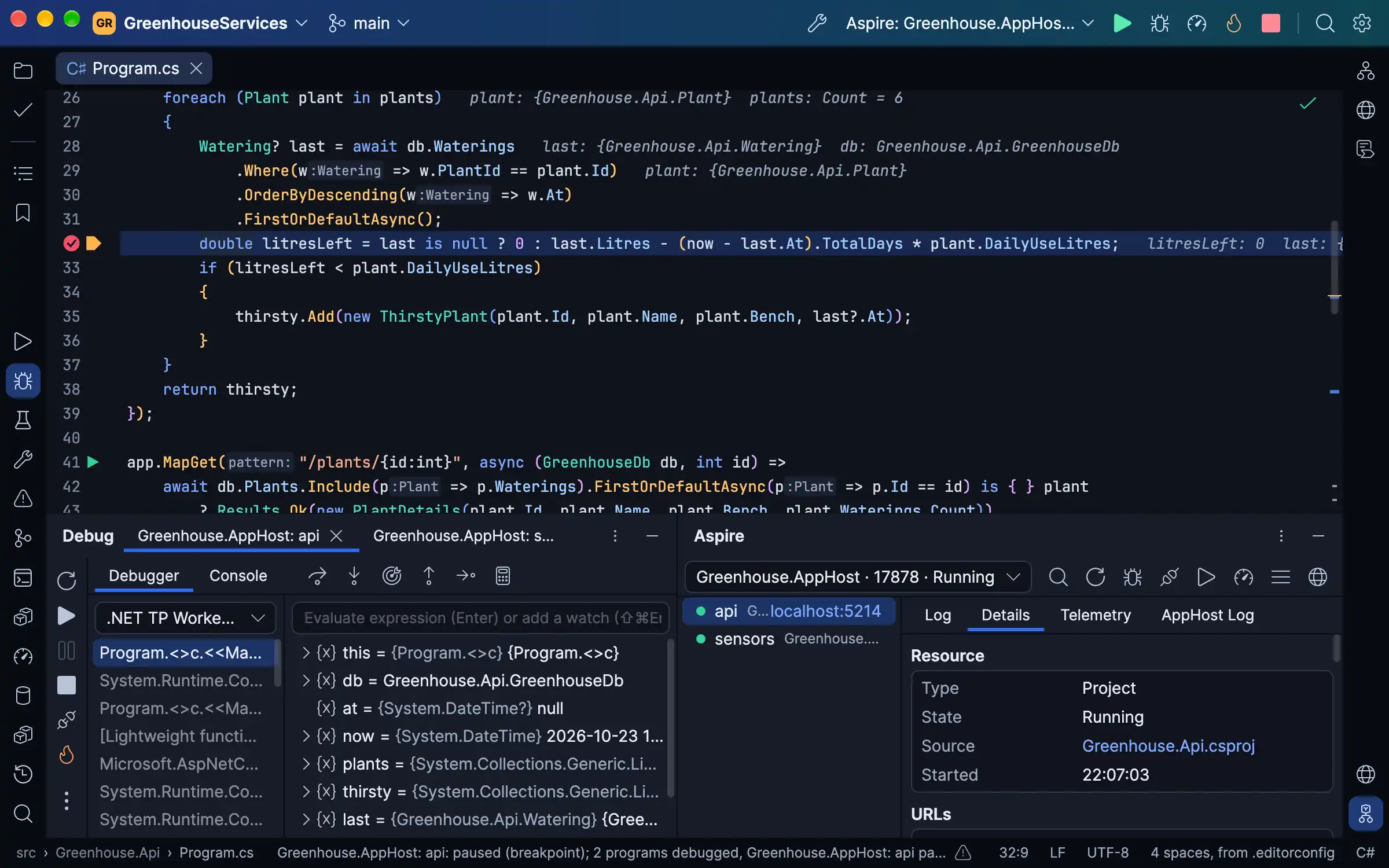 An Aspire AppHost debugged in Passenger: the API service stopped at a breakpoint with its values after the lines, a Debug tab for each service, and the Aspire window listing both services running with the API's details