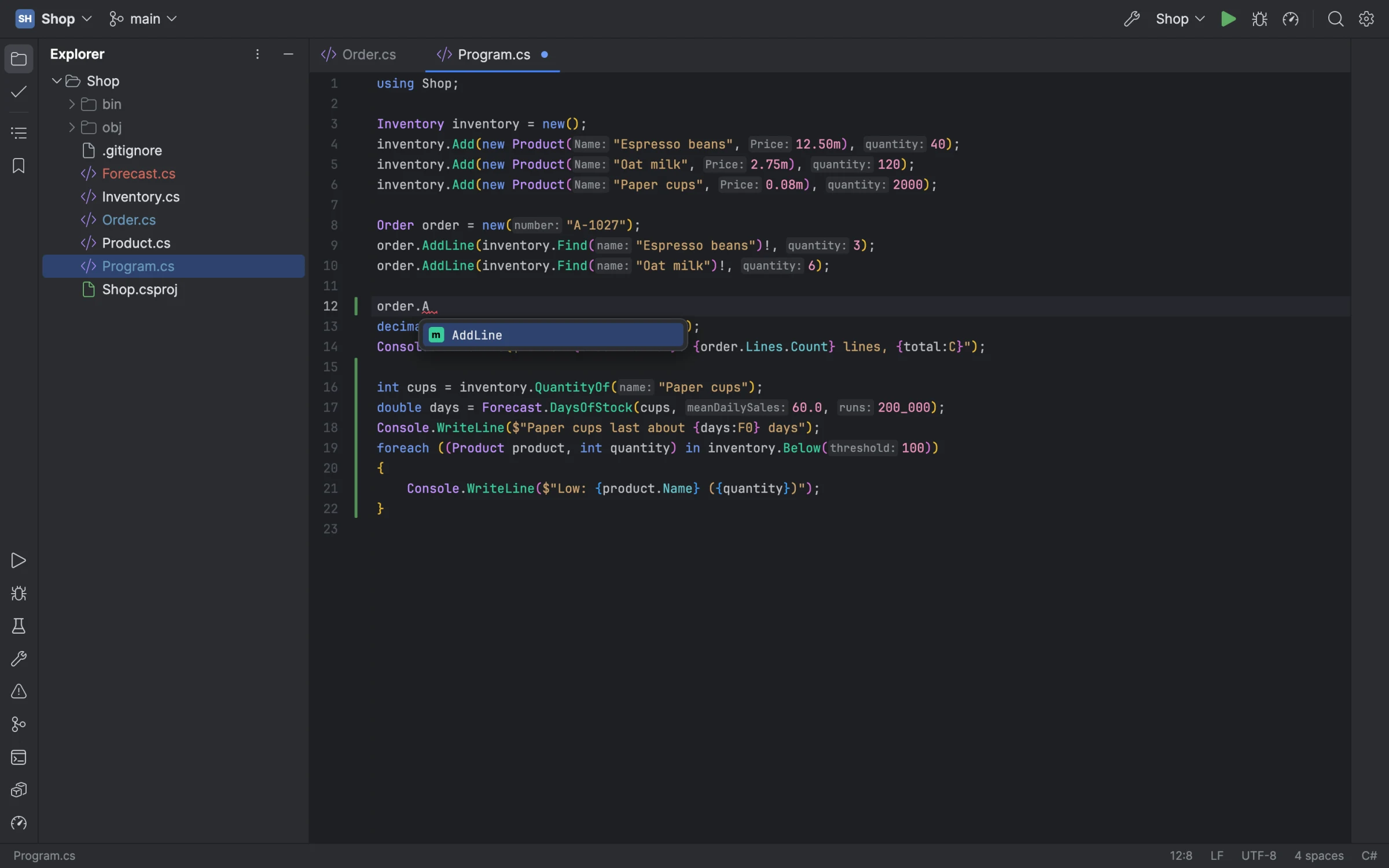 Passenger's editor: completion open after a dot, parameter name hints before literal arguments, and the change bars of uncommitted lines
